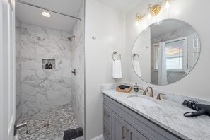 Shower, hair dryer, towels, soap