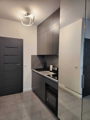 Fridge, oven, electric kettle, toaster