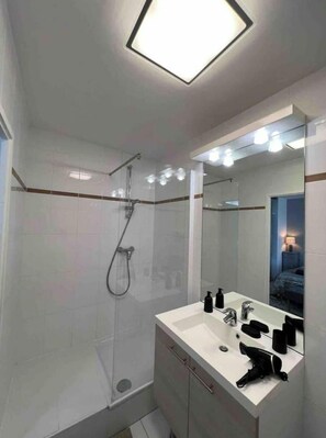 Shower, hair dryer, towels, soap