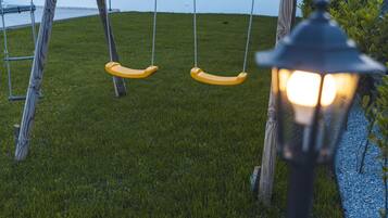 Relax in a serene setting with a peaceful swing and scenic views.