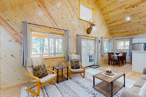 Dog-friendly, lakefront getaway with a firepit, dock, washer/dryer, & AC