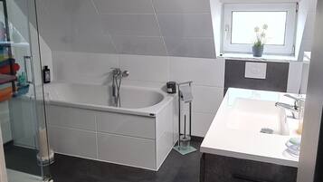 Shower, hair dryer, towels, toilet paper