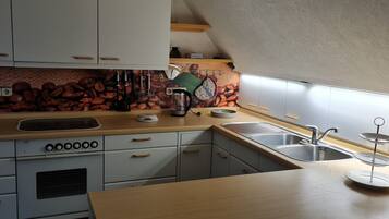 Fridge, microwave, stovetop, coffee/tea maker