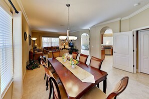 Enjoy meals in this inviting dining area with a long table and six chairs.