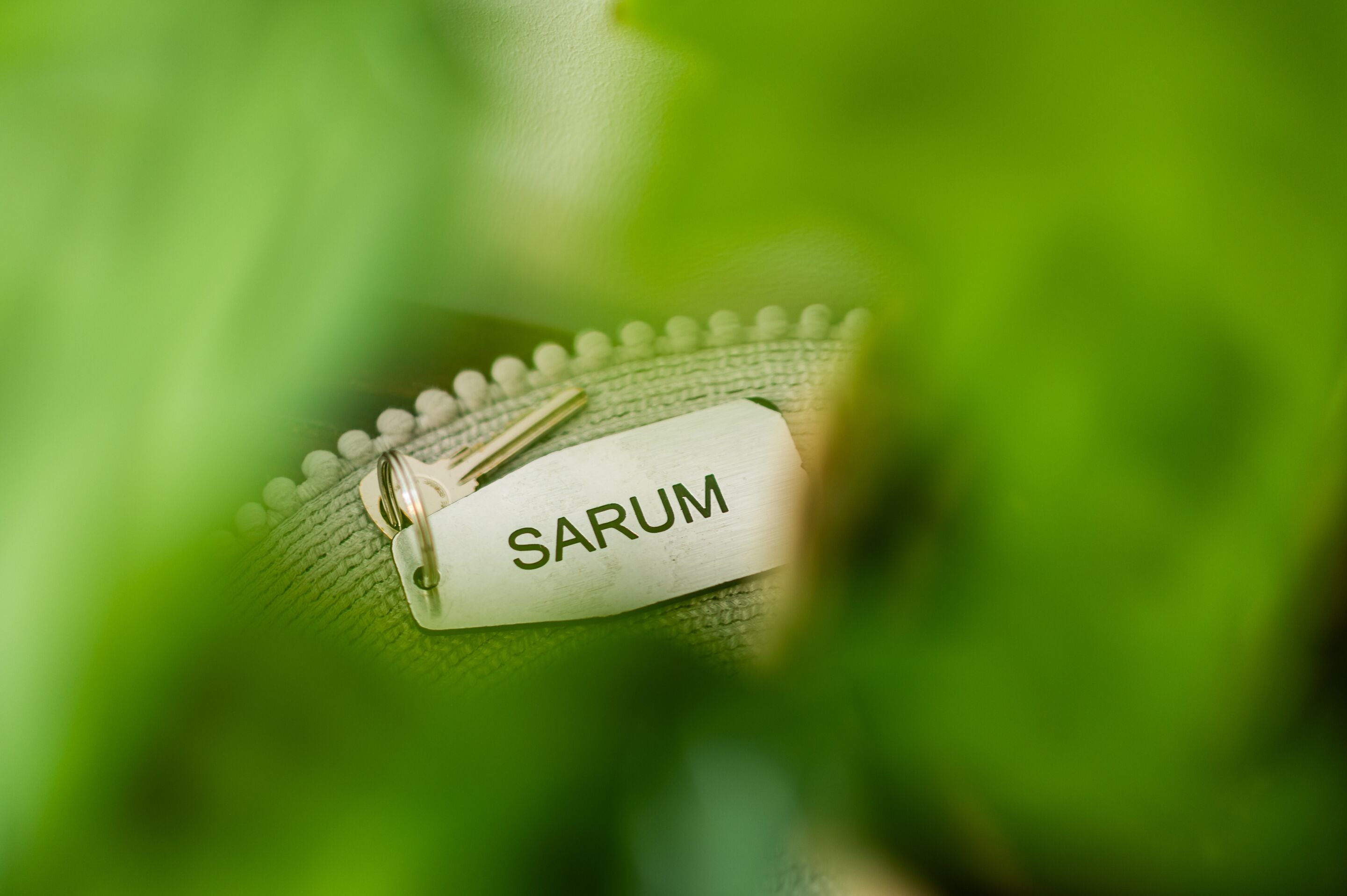 A keychain with the word "SARUM" on it.