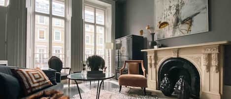 TV, fireplace, books, music library