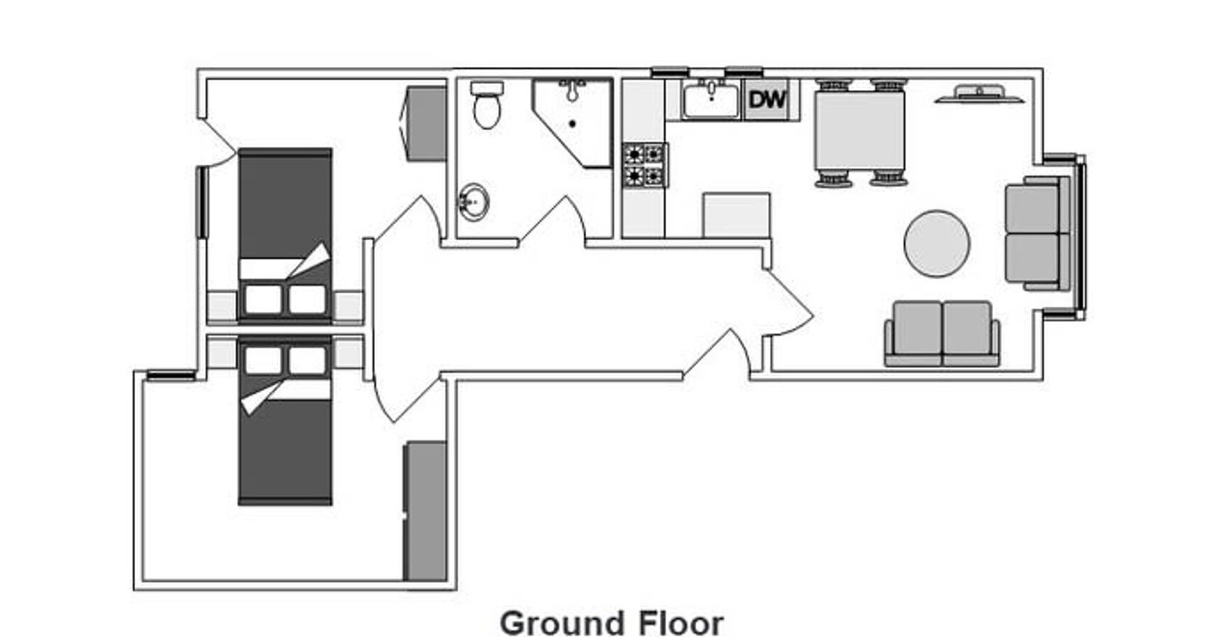 Plan d’un rez-de-chaussée d’hôtel comprenant une grande pièce, un coin cuisine, une salle de bain et un espace repas.