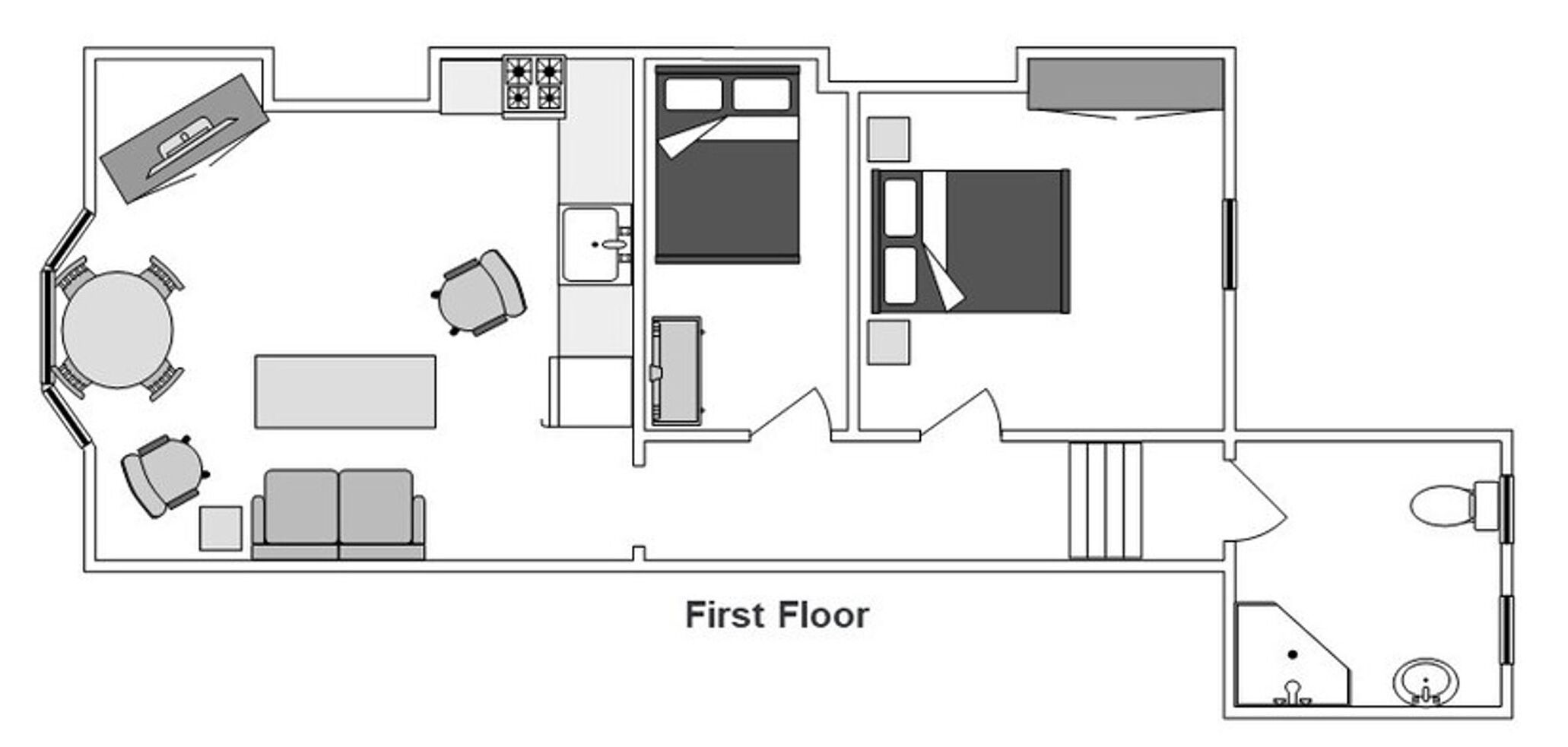 A first-floor layout with a dining area, kitchen, and a small bathroom.