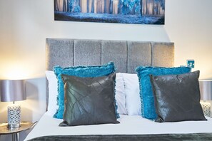 A bed with two pillows, a headboard, and a bedside table with a lamp. - Host Stay 82G Galgate (Barnard Castle)