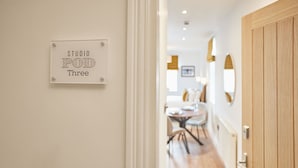 A hallway with a sign reading "STUDIO POD Three". - Host Stay Studio Pod 3 (Saltburn-by-the-Sea)