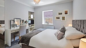A modern bedroom with a large bed, a desk, and a chair. - Host Stay Brooklands Timeless (Scarborough)