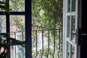 Enjoy a serene view of lush greenery from the comfort of your room.