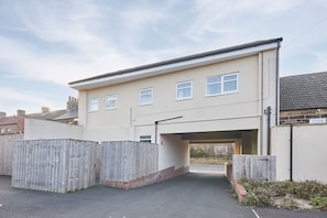 Stunning two-story residence with a central entrance and covered driveway.