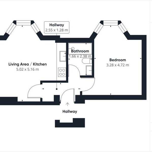 Plan d’étage d’un hôtel comprenant un espace de vie/cuisine de 5,02 x 5,16 m, une salle de bain de 1,66 x 2,38 m, une chambre de 3,28 x 4,72 m et un couloir de 2,55 x 1,28 m.