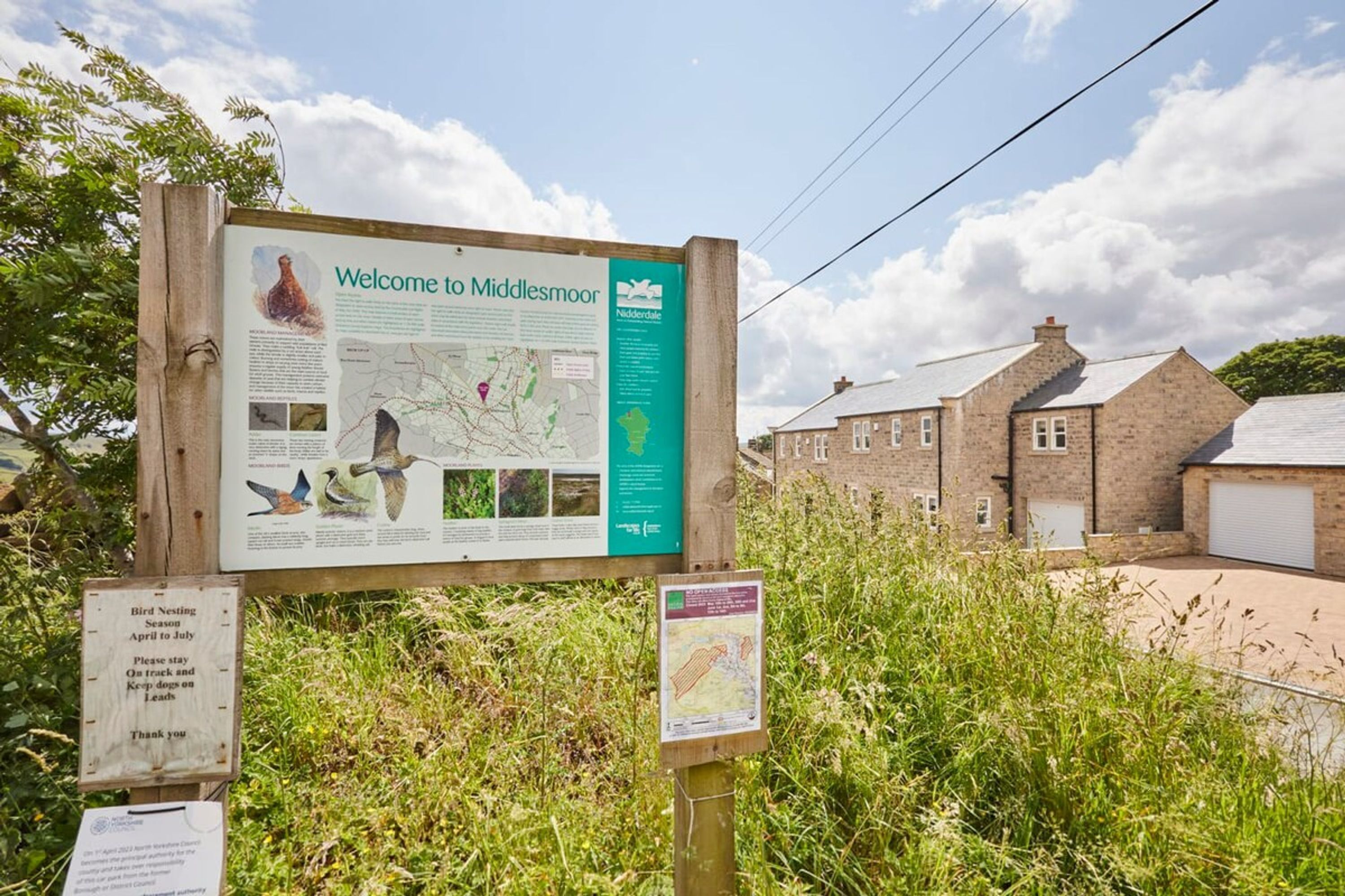A welcome sign at Middlesmoor with a map and bird nesting information.