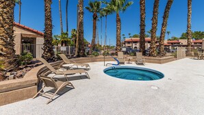 A pool area with lounge chairs and palm trees. - 1 Bedroom Condo, Sparkling Pool, Fitness Center, Pets Welcome (Glendale)