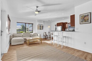 Signature Apartment | Living area | 55-inch Smart TV with digital channels