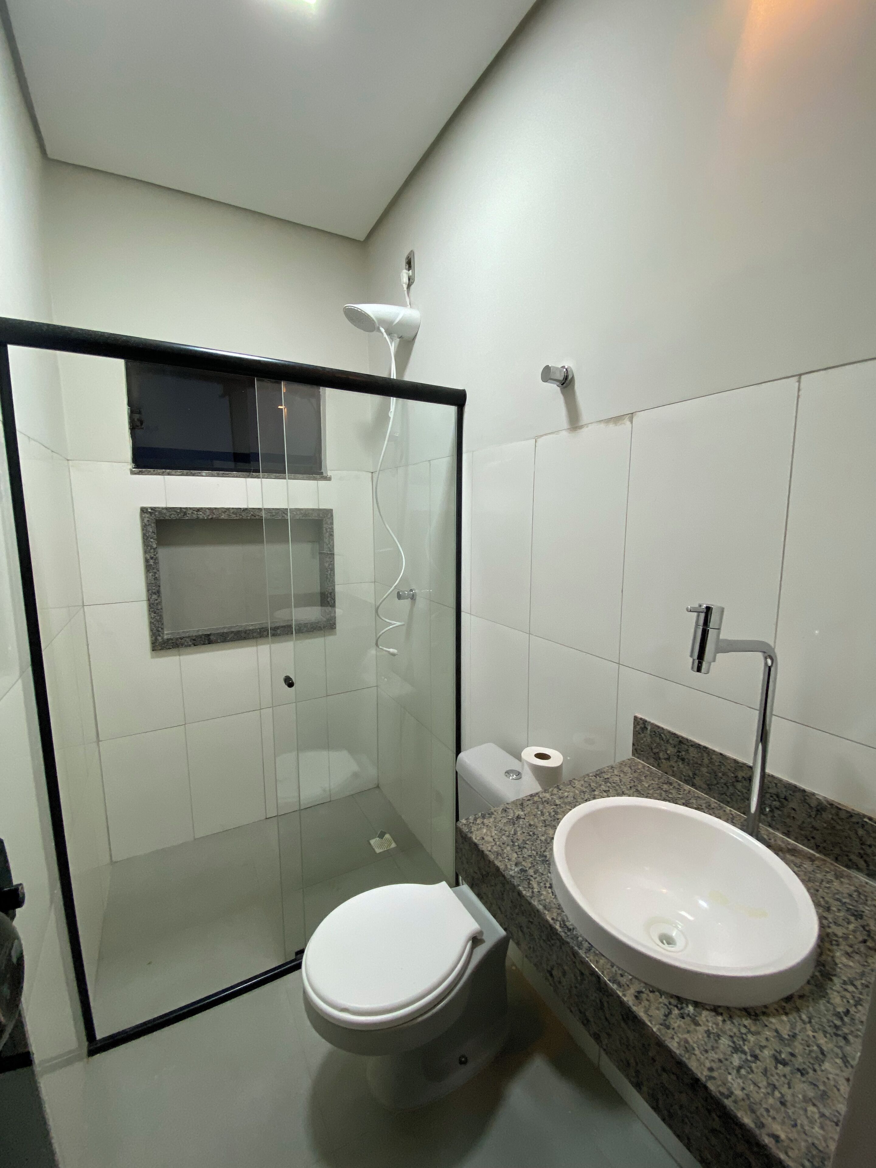 Shower, hair dryer, towels, toilet paper