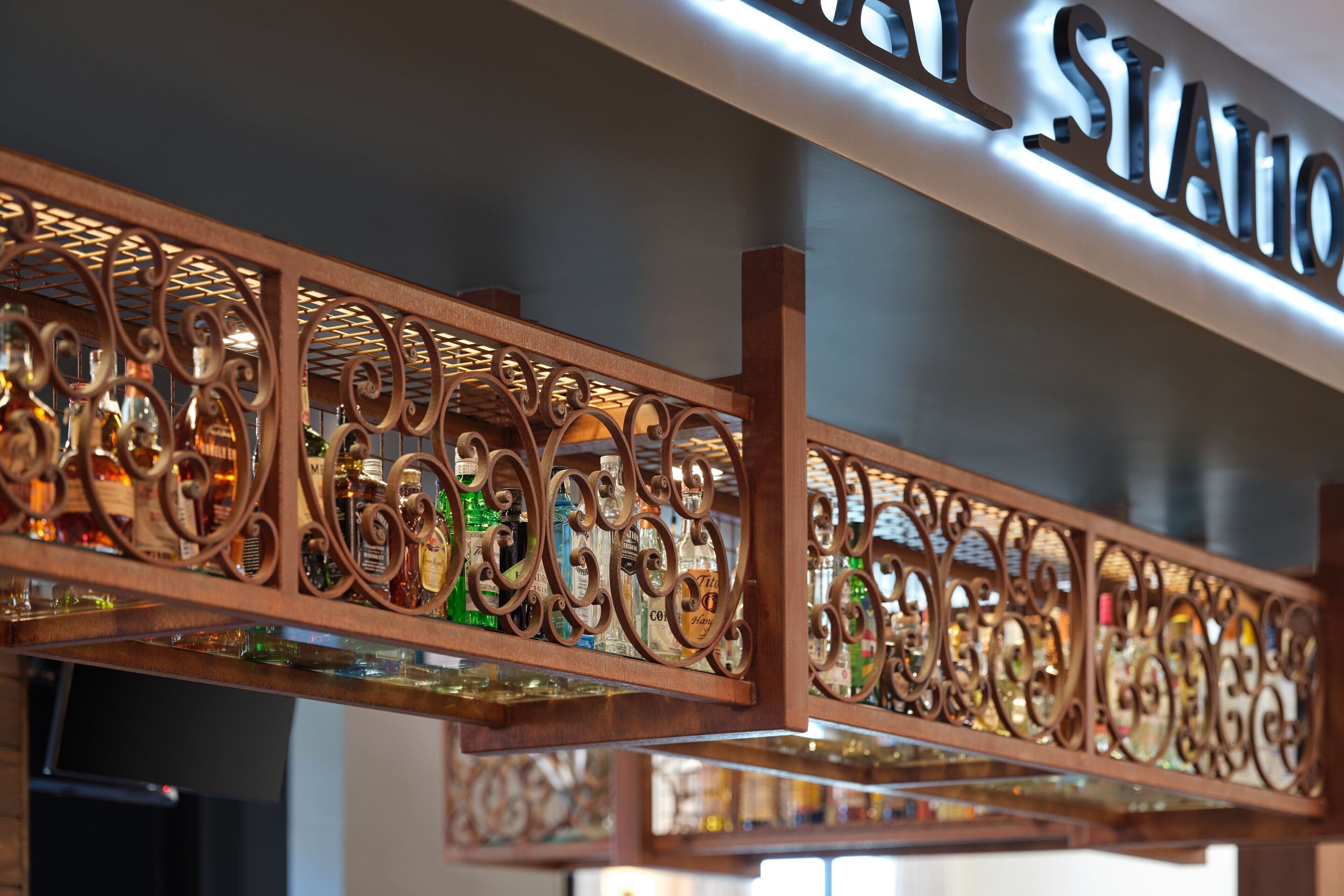 A decorative metal railing with a sign above it.