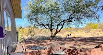 Desert Gem Guest House nestled among lush Mesquite trees.