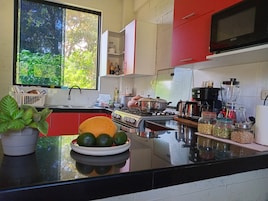 Full-size fridge, shared microwave, cookware/dishes/utensils