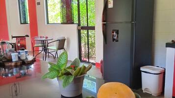 Full-sized fridge, microwave, cookware/dishes/utensils