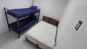A dormitory room with bunk beds and a single bed. - Hostel Vila Brás  (São Paulo)