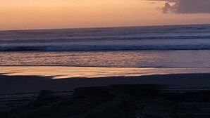 A beach with waves and a sunset. - # 40 At the Beach (Waitārere Beach)