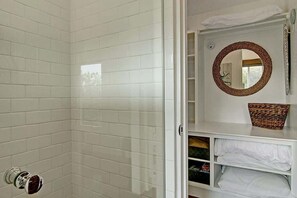 Shower, hair dryer, towels, shampoo