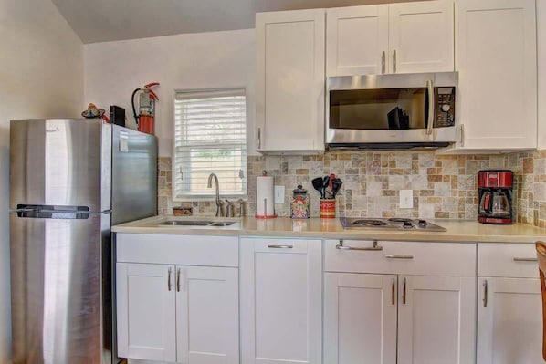 Fridge, microwave, stovetop, coffee/tea maker