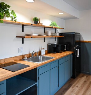 Fridge, microwave, stovetop, coffee/tea maker