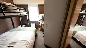 A compact hotel room with bunk beds, a desk, and a wardrobe. - Super Hotel Mito Natural Onsen (Mito)