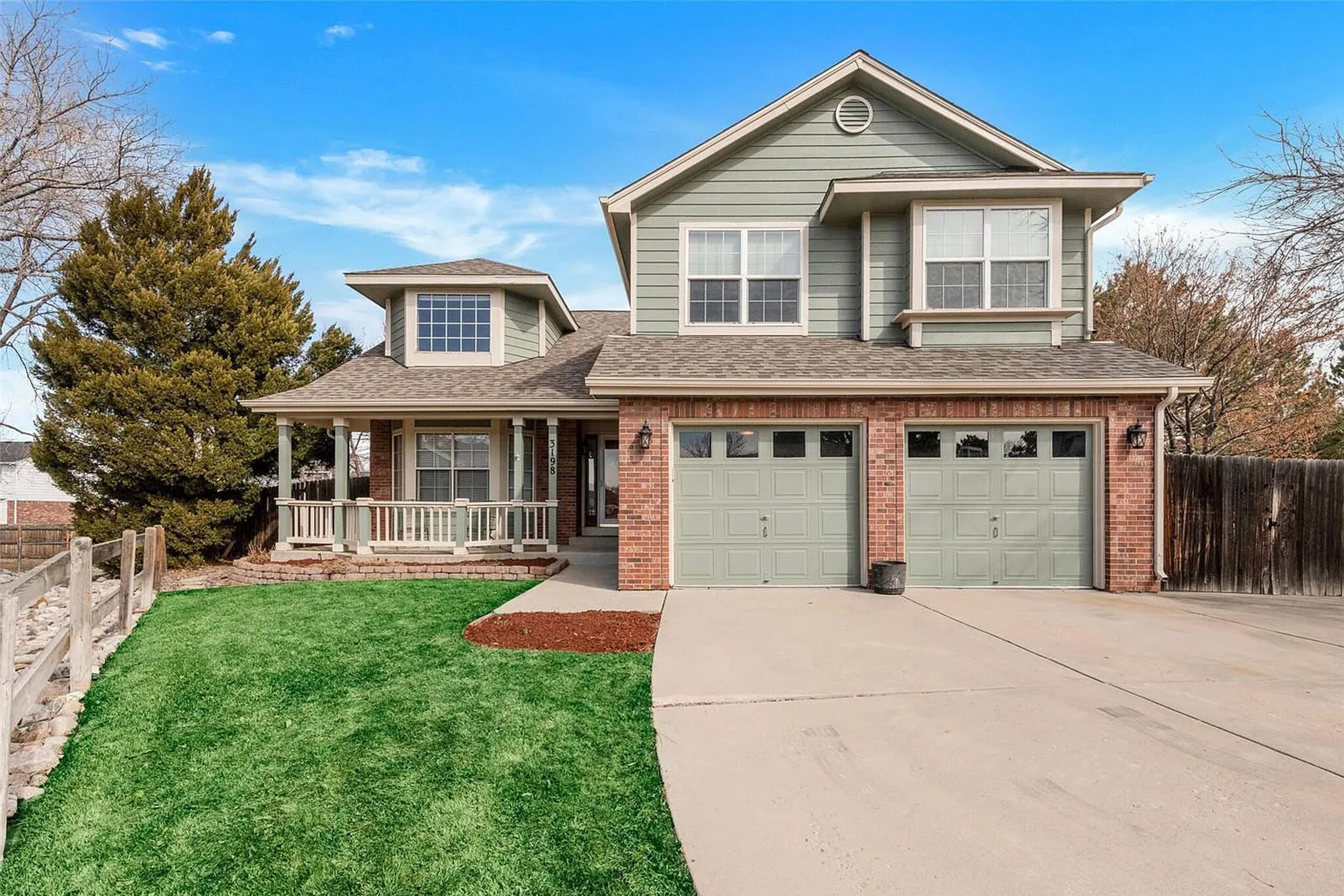 Private home with fenced yard, deck, fireplace, home office, & great location