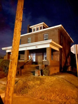 A two-story house with a front porch, a visible staircase, and a garage. - 629 on Main Rental A
(Point Pleasant)