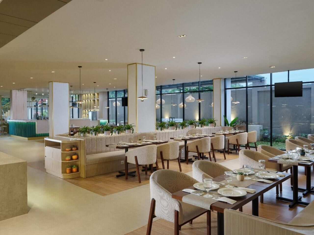 A modern restaurant with a bar area, multiple dining tables, and chairs.