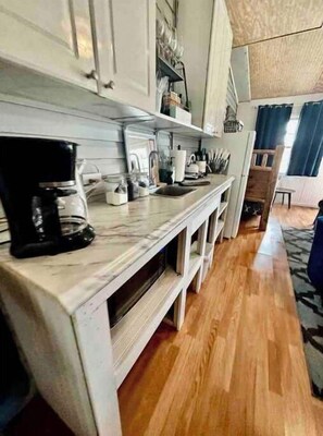 Fridge, coffee/tea maker, electric kettle, toaster
