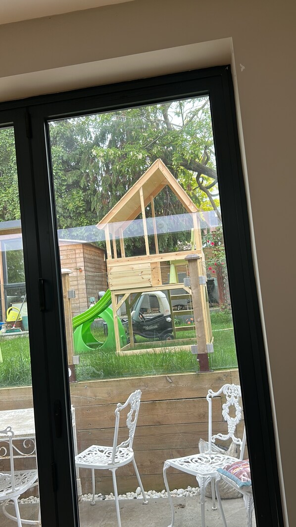 Guests can enjoy a view of the outdoor play area from the comfort of their room.