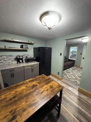Room 2 | Private kitchen | Fridge, microwave, oven, stovetop - Caribou Crossing Motel (Walden)