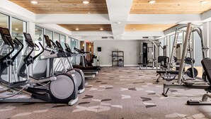 A gym with treadmills, elliptical machines, and weight equipment. - Riverwalk Luxe Apartment, Stunning pool, King Bed (San Antonio)