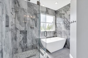 Jetted tub, hair dryer, towels, soap