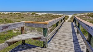 A wooden boardwalk leading to a beach with clear skies. - Beachfront Oasis on Amelia Island Condo - 2 Bedroom Ketch Courtyard (Fernandina Beach)
