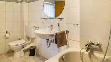 Bathtub, hair dryer, towels