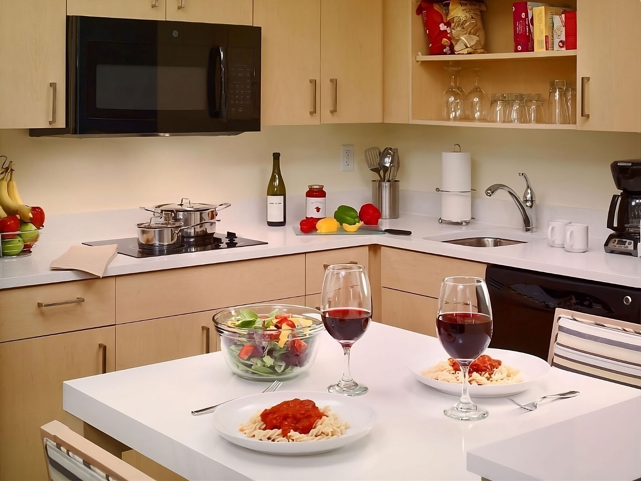 Cook and toast together in the fully equipped modern kitchenette.