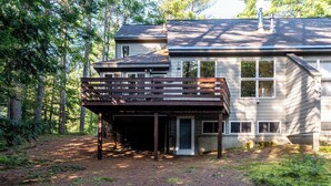 A two-story house with a covered deck and a small porch. - Spacious Home near Diana's Baths! (Conway)