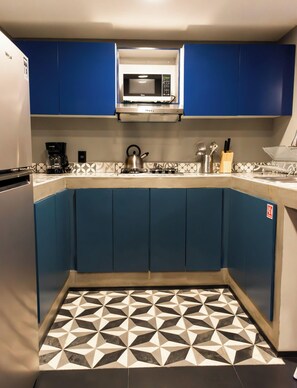 Fridge, microwave, stovetop, coffee/tea maker