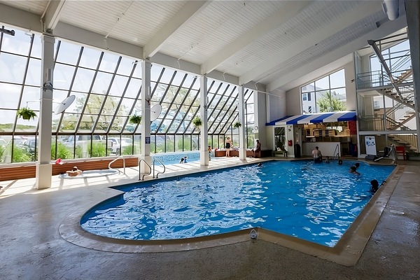 Dive into the sunlit indoor pool for year-round bliss.
