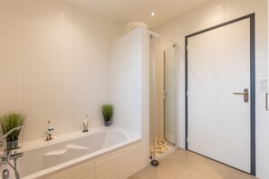 Bathtub, hair dryer, towels