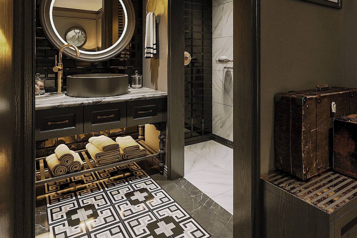 A modern bathroom with a round mirror, a sink, and a shower area.