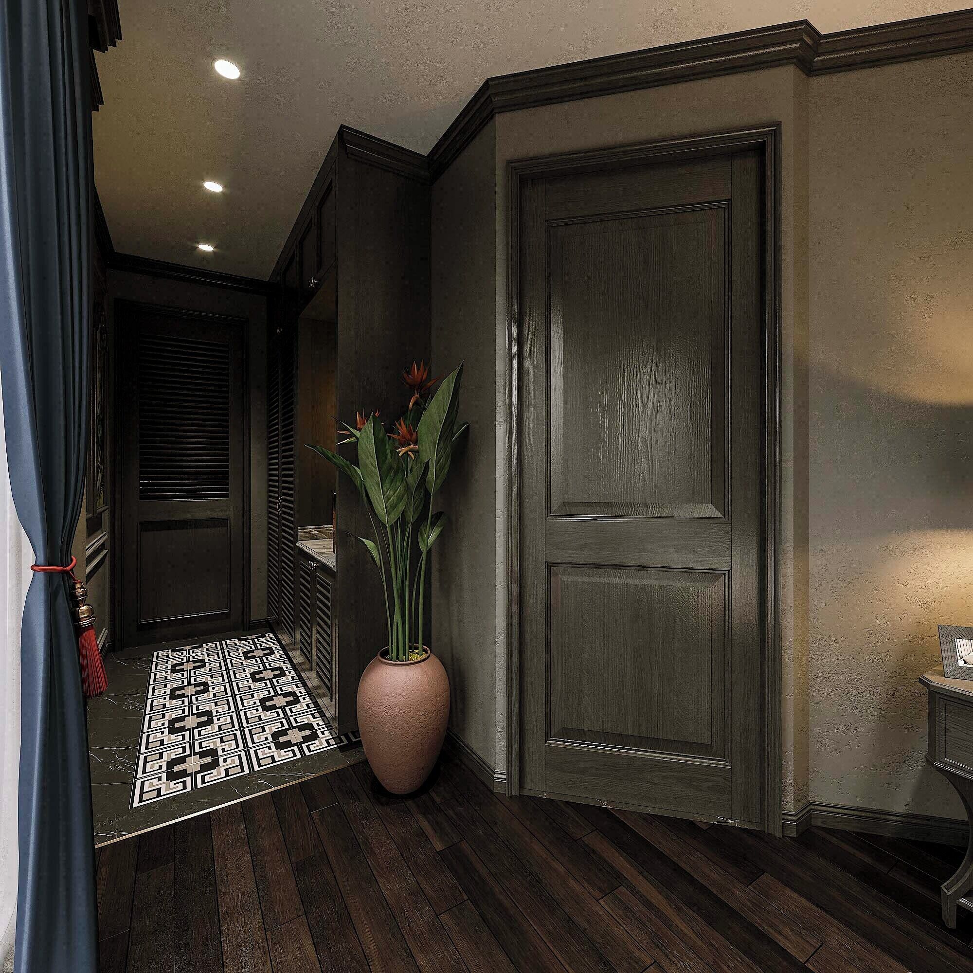 A hallway with a patterned rug, a large vase with flowers, and a dark wooden door.