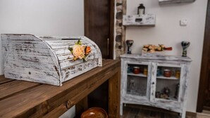 A rustic wooden table with a white, distressed wooden chest of drawers. - A Place in the Sun - Caltanissetta (Caltanissetta)